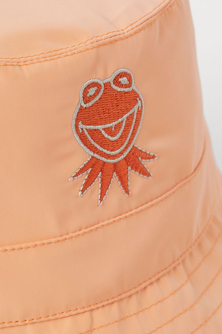 light orange bucket hat